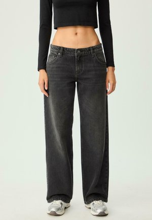 Black wide-leg jeans with a high waist, featuring a faded texture and five-pocket design, paired with grey sneakers.