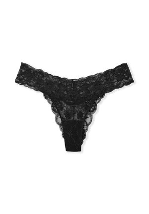 String en dentelle noire avec des motifs floraux, des bords festonnés et un design transparent. L'arrière est sans couture avec un panneau central plein.