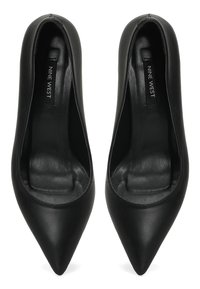 Black leather pointed-toe pumps with a sleek design, smooth texture, and rounded cut around the ankle for a comfortable fit.