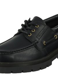 Black leather boat shoe featuring a round toe, lace-up design, and gold-toned eyelets. Textured sole for grip with contrasting stitching details.
