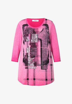 Roze tuniek met lange mouwen, voorzien van een grafische print in zwart, met gestructureerde patronen en een ronde halslijn. Casual, lichtgewicht ontwerp.