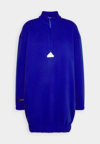Oversized zip-up sweatshirt i kungljusblå, med hög krage, ribbade muddar, elastisk nederkant och en vit logotypdetalj på framsidan.