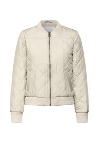 Veste bomber matelassée beige clair avec fermeture éclair à l'avant, poignets et ourlet côtelés, présentant une couture diagonale et des poches latérales.
