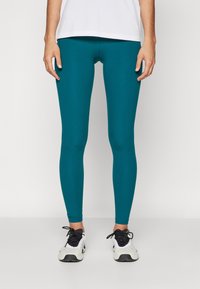 Under Armour Leggingek - hydro teal/white