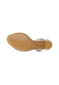 Witte sandalen met bandjes, voorzien van een doorzichtige plastic band en een lichtbruine rubberen zool met ribbels voor grip. Maat gemarkeerd als 37.