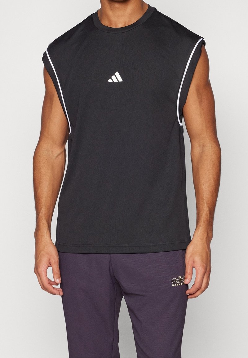 Black sleeveless athletic shirt made from breathable fabric, featuring a white logo on the chest and white accent stitching along the shoulders.