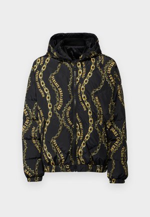 Black puffer jacket with a hood, featuring gold chain and "Versace Jeans Couture" text pattern. Front zip closure and elastic cuffs.