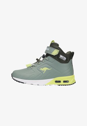 Water-resistant athletic shoe in light green and dark green. Features a padded collar, laces, and a white sole with air pockets.