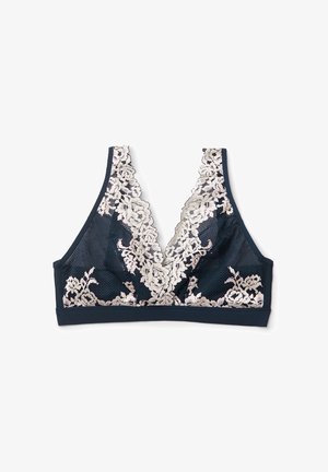 Marineblå bh med dyb V-hals, der har et indviklet beige blomstret blonderoverlay og blødt mesh-stof. Tilbyder et sømløst, støttende design.