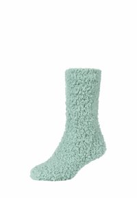 Flauschige, mintgrüne Socke aus weichem Material; verfügt über eine flauschige Textur und ein Design bis zur Mitte der Wade. Ideal für Wärme und Komfort.