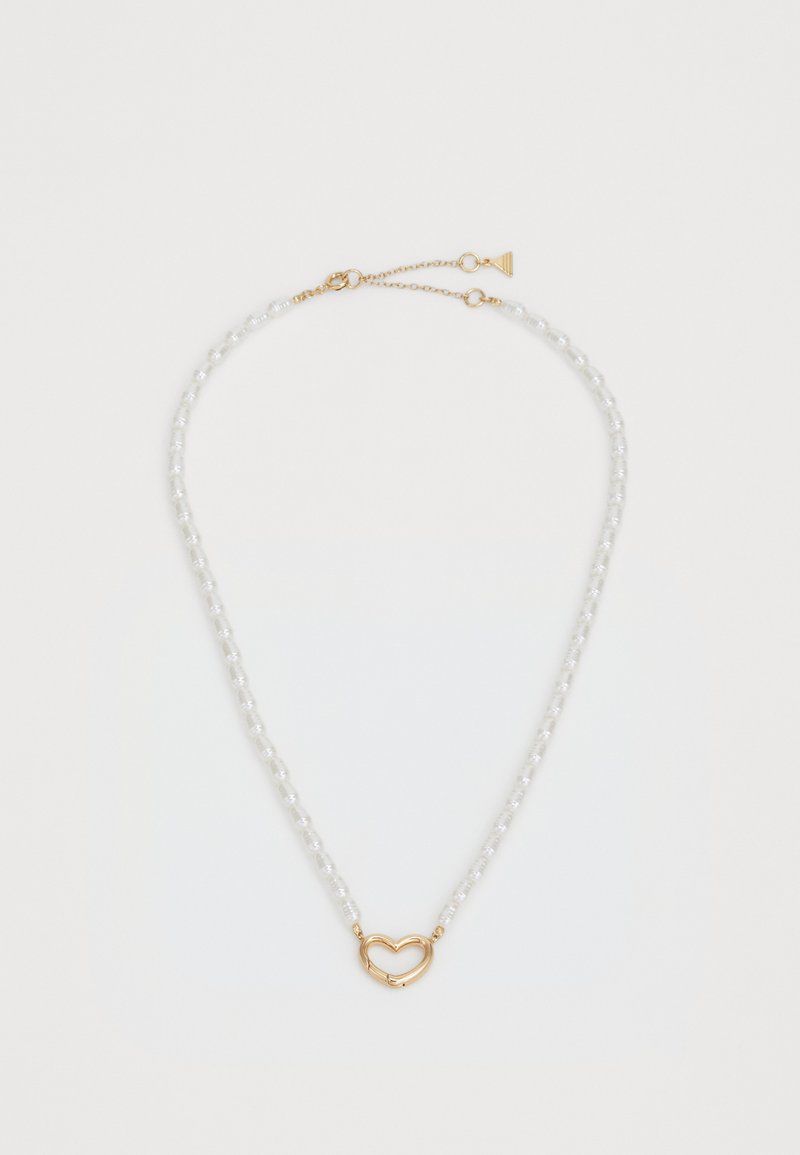 Valge pärlipael kuldse südamekujuliselt kinnitusega. Beeditud disain ja reguleeritav kett pikkuse muutmiseks.