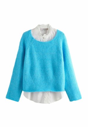 Light blue cropped sweater made of fluffy fabric, featuring a wide neckline, long sleeves, and layered over a white collared shirt with lace accents.