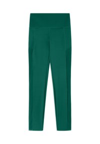 Leggings verts en matériau extensible, dotés d'une taille haute et de poches latérales, avec une texture lisse et une coupe ajustée.