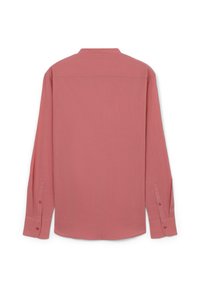 Camicia a maniche lunghe in rosa cipria, realizzata in un tessuto testurizzato. Presenta un collo a camicia e polsini con bottoni, progettata con una vestibilità rilassata.