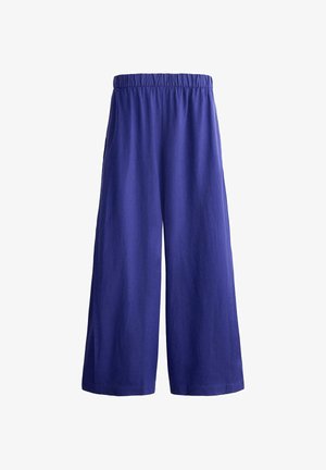 Bukser med vide ben i ensfarvet royalblå med elastisk taljebånd, vist på en hvid baggrund.