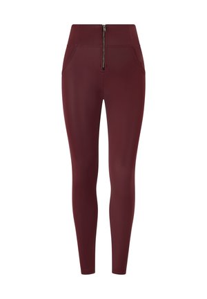 Leggings color bordeaux con vita alta, texture liscia, due tasche frontali e dettaglio centrale con zip in vita.