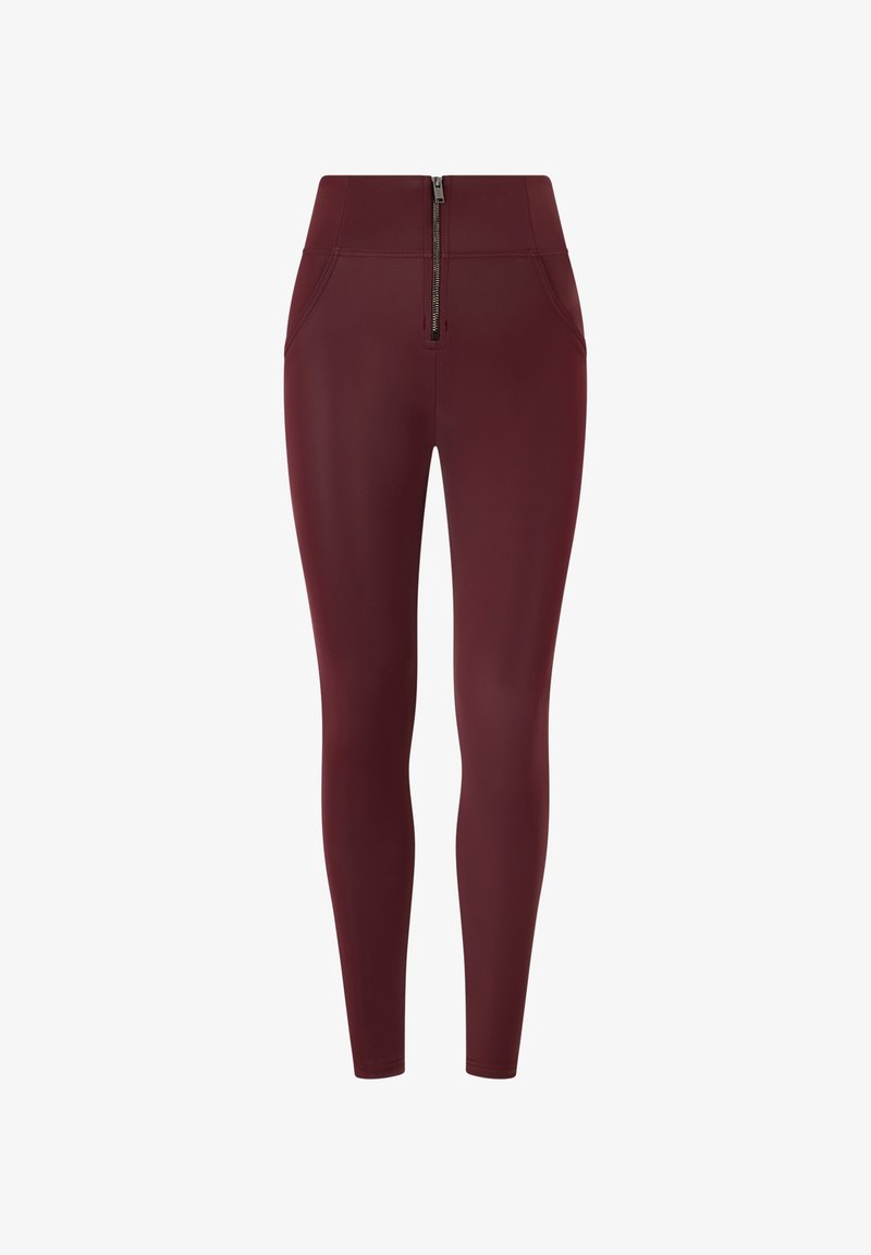 Leggings color bordeaux con vita alta, texture liscia, due tasche frontali e dettaglio centrale con zip in vita.