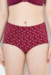 Sous-vêtements taille haute couleur bordeaux avec un motif floral, fabriqués en tissu doux. Présente un petit nœud décoratif au niveau de la taille.