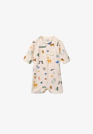 Kreemikarva lühikeste varrukatega kombinesoon, millel on värvikad loomamustrid. Valmistatud kerge kangaga, allosas on trukid, mis teevad riietamise lihtsaks.