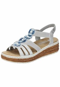 Sandale argentée pour femme avec semelle compensée en liège, brides élastiques et fleurs en tissu bleu ornées de perles blanches.