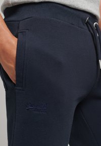 Superdry & Co Spodnie treningowe