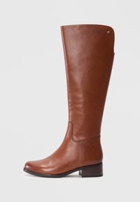 Brown leather knee-high boot with a sleek design, a rounded toe, minimal stitching, and a low block heel. No visible hardware or accents.