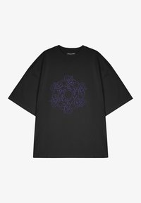 Black T-shirt with oversized fit, featuring a purple graphic design at the center. Thick cotton material, short sleeves, and a crew neck.