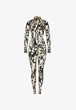 Heldragt i blødt stof med sort-hvidt kødmønster, høj krave og lynlås lukning fortil.