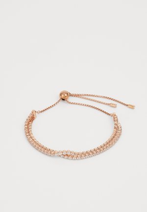 Rose gold bracelet with a chain design featuring alternating clear stones. Adjustable slider closure with two textured metal ends.