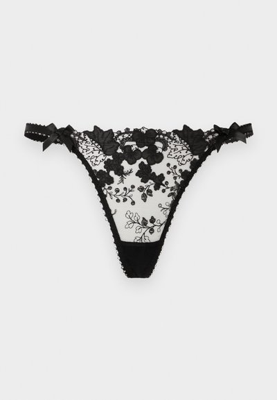 Μαύρο λευκό εσώρουχο τύπου στρινγκ με κεντήματα με λουλούδια, διαφανές τούλινο κομμάτι και μικρά πλεκτά φιόγκια στο ελαστικό κορδόνι της μέσης.