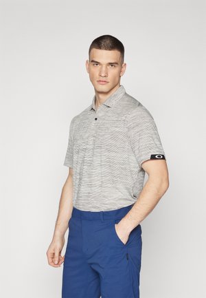 Gray striped polo shirt with a subtle texture and a black logo accent on the sleeve, paired with blue shorts featuring side pockets.
