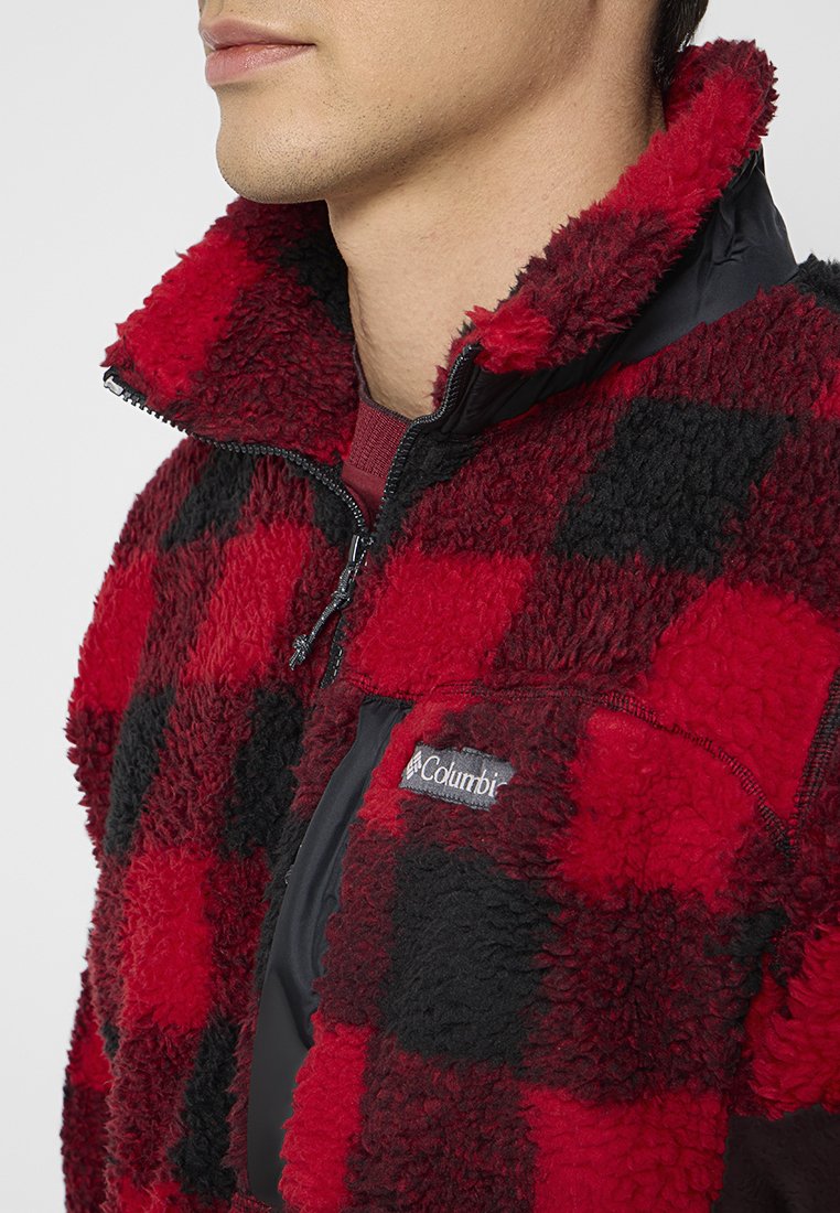 Czerwono-czarna, w kratę polarowa bluza z połowicznym zamkiem i logo Columbia; teksturowany, pluszowy materiał; boczna kieszeń na zamek.