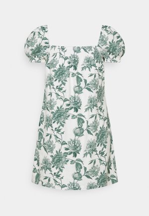 Weißes Kleid mit grünem Blumenmuster, kurzen Puffärmeln, quadratischem Ausschnitt und lockerem Schnitt. Hergestellt aus leichtem Stoff.