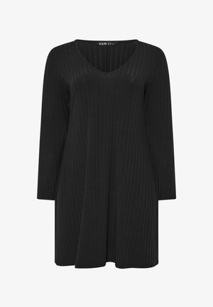 Czarna, prążkowana sukienka z dekoltem w kształcie litery V i długimi rękawami. Rozkloszowany krój. Miękka faktura i minimalistyczny design.