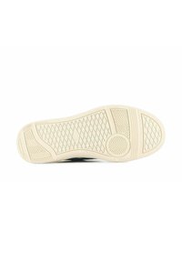 Gummisneaker sula i krämfärg, med ett texturerat mönster av diagonala linjer och cirkulära detaljer för grepp och stabilitet.