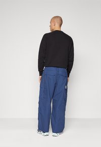 Carhartt WIP JET PANT - Kargopüksid - blue rinsed