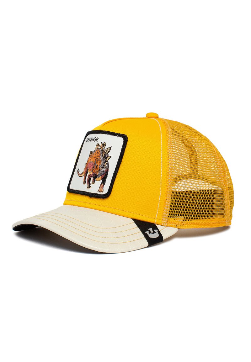 Gorra de camionero amarilla con parte trasera de malla, que presenta un parche frontal con una ilustración de un dinosaurio, visera beige y etiqueta de acento negra.