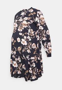 Vestido de maternidade floral em azul-marinho com mangas compridas, apresentando um design em camadas e padrões florais em rosa, creme e castanho.