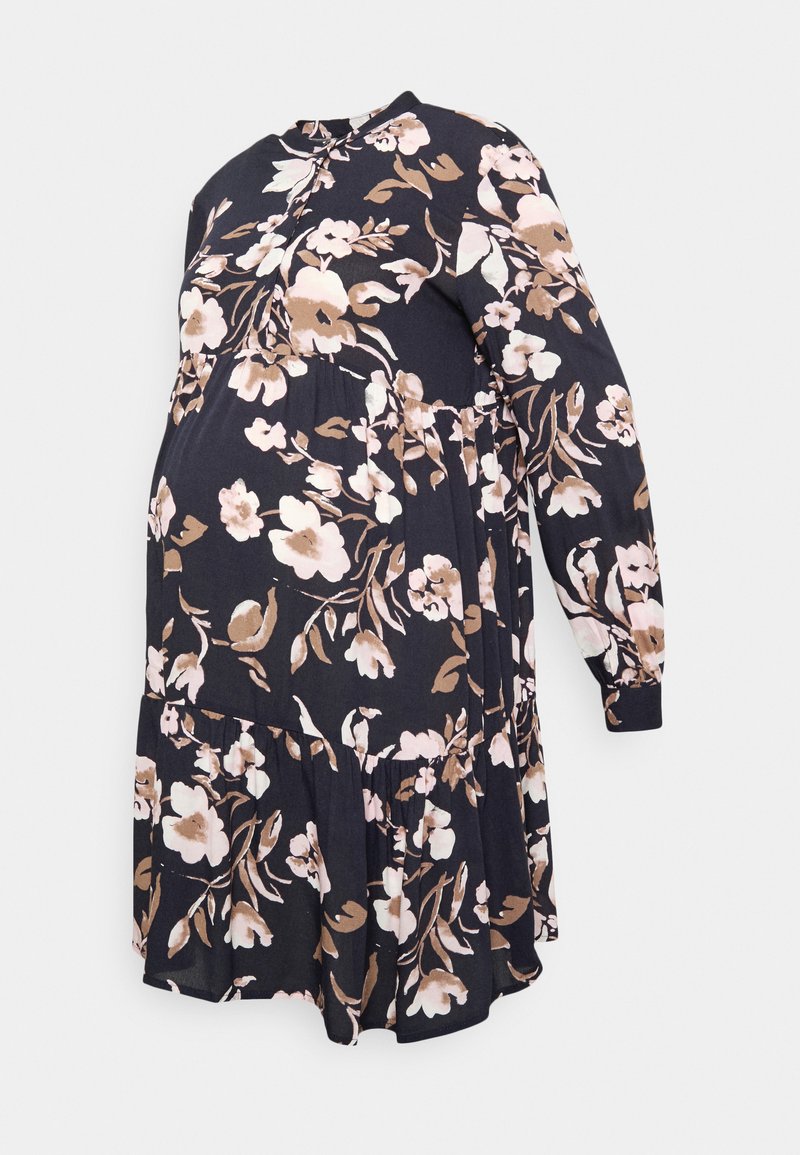 Vestido de maternidade floral em azul-marinho com mangas compridas, apresentando um design em camadas e padrões florais em rosa, creme e castanho.