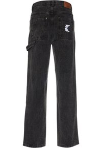 Black denim pants with a relaxed fit, featuring a white logo on the back pocket and a side pocket. Durable fabric with subtle fading.