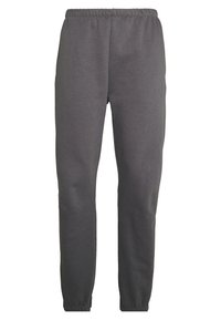 Grå mjukisbyxor i en mjuk bomullsblandning; elastisk midja, smalnande ben och inga synliga fickor. Slät textur med en avslappnad passform.