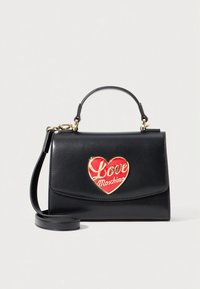 Black leather handbag with top handle and detachable shoulder strap, featuring a red heart emblem with "Love Moschino" in gold lettering.