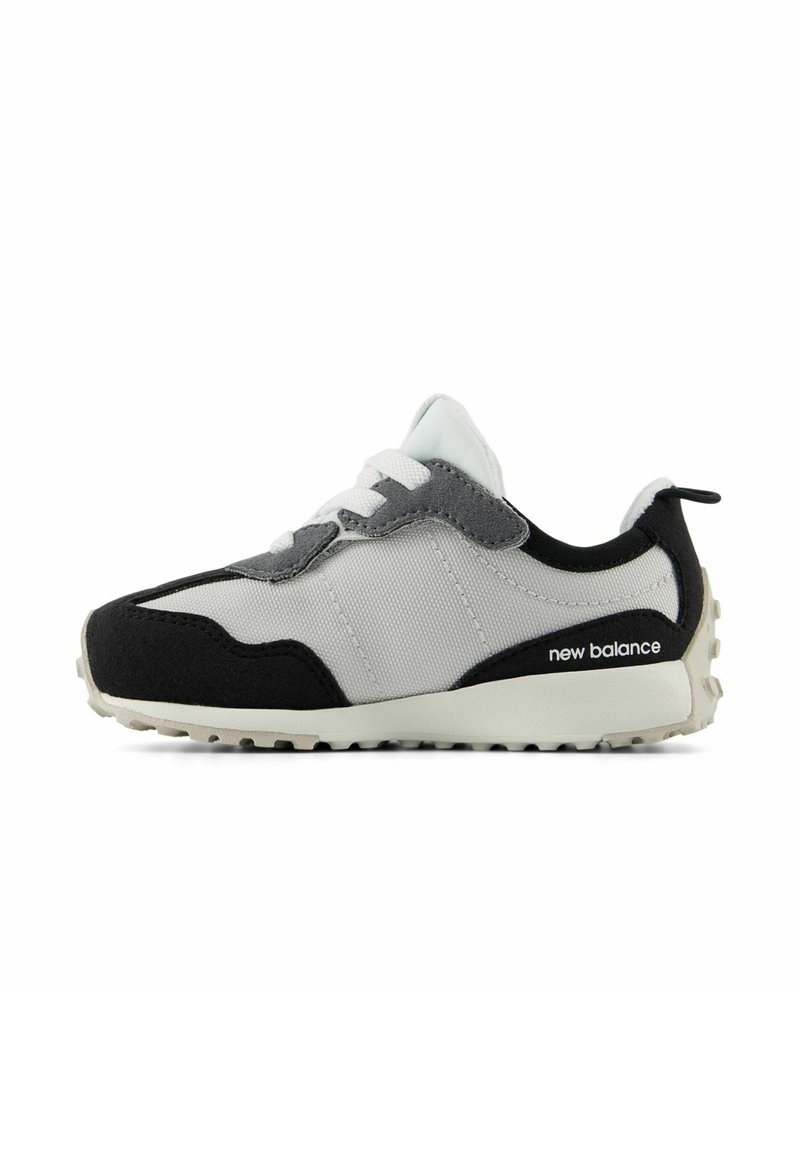 Sneaker with a black, gray, and white color scheme; features a fabric upper, suede accents, white laces, and a textured rubber sole.