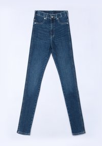 Höga blå denimjeans med en slim-fit design, kontrasterande sömmar och dragkedja. Har fem fickor för förvaring.