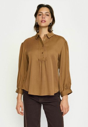 Brown, button-down blouse with long puff sleeves and pleated front detail. Made from smooth fabric, featuring a classic collar and subtle sheen.