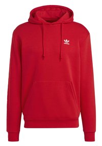 Röd hoodie i mjuk bomullsblandning med justerbar dragsko, framficka och vit Adidas-logotyp på bröstet.
