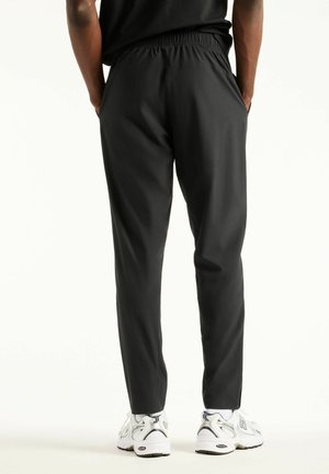 New Balance, UTILITY STRETCH WOVEN PANT - Træningsbukser - black