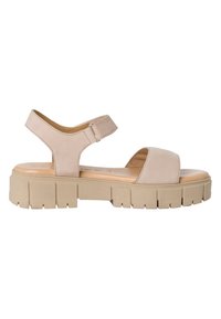 Beige sandal with a wide front strap and adjustable ankle strap. Chunky beige sole with grooves for traction. Smooth texture.