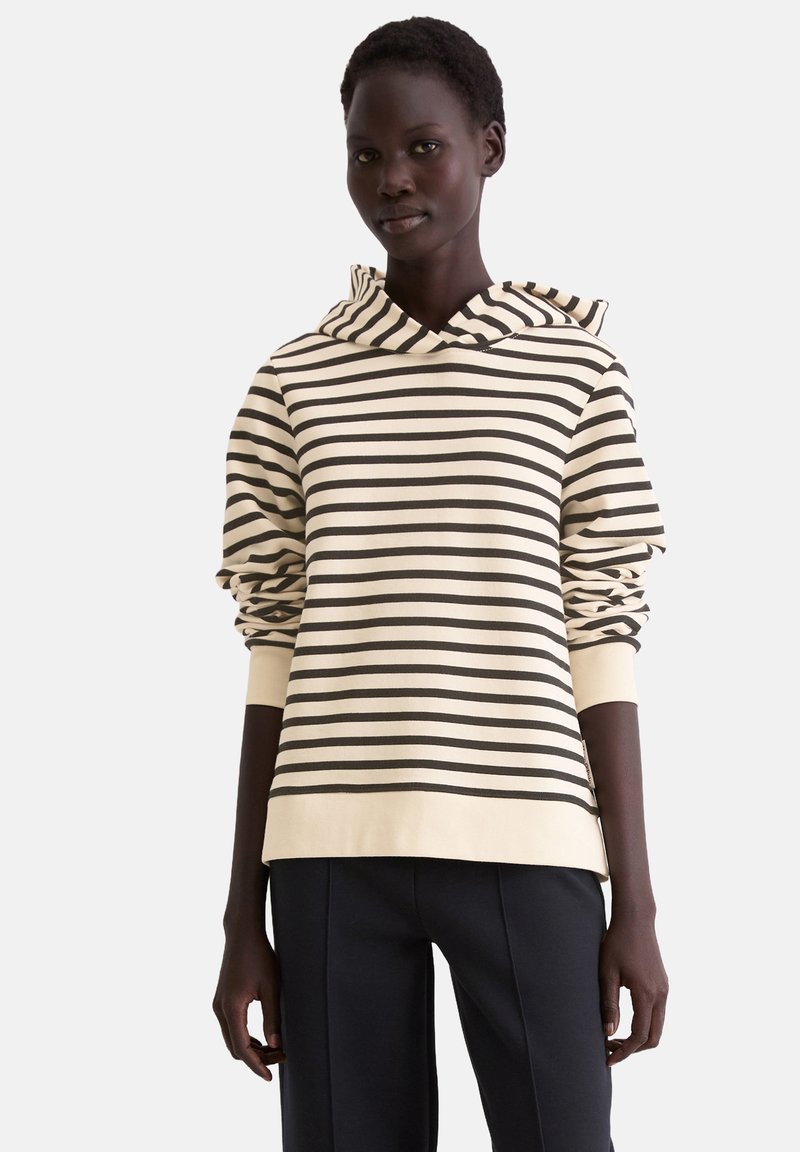 Gestreepte hoodie in crème en donkerbruin, met een trekkoordkap en geribbelde manchetten. Gemaakt van zachte, textuurrijke stof met een relaxte pasvorm.