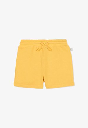 Żółte bawełniane spodenki dla maluchów z elastycznym pasem i związanym sznurkiem, gładki design, mała metka marki na prawym bocznym szwie.